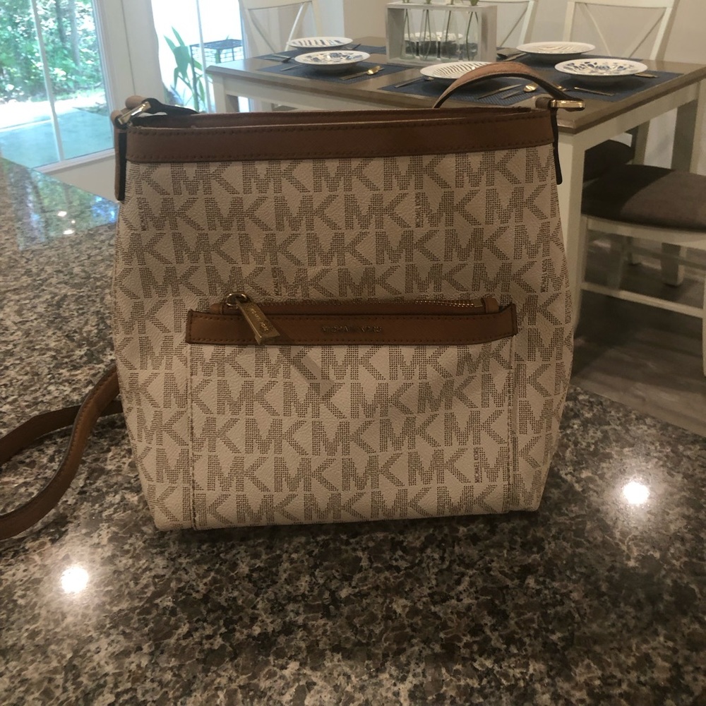Authentic Michael Kors crossbody handbag with MK logo.  Excellent used condition